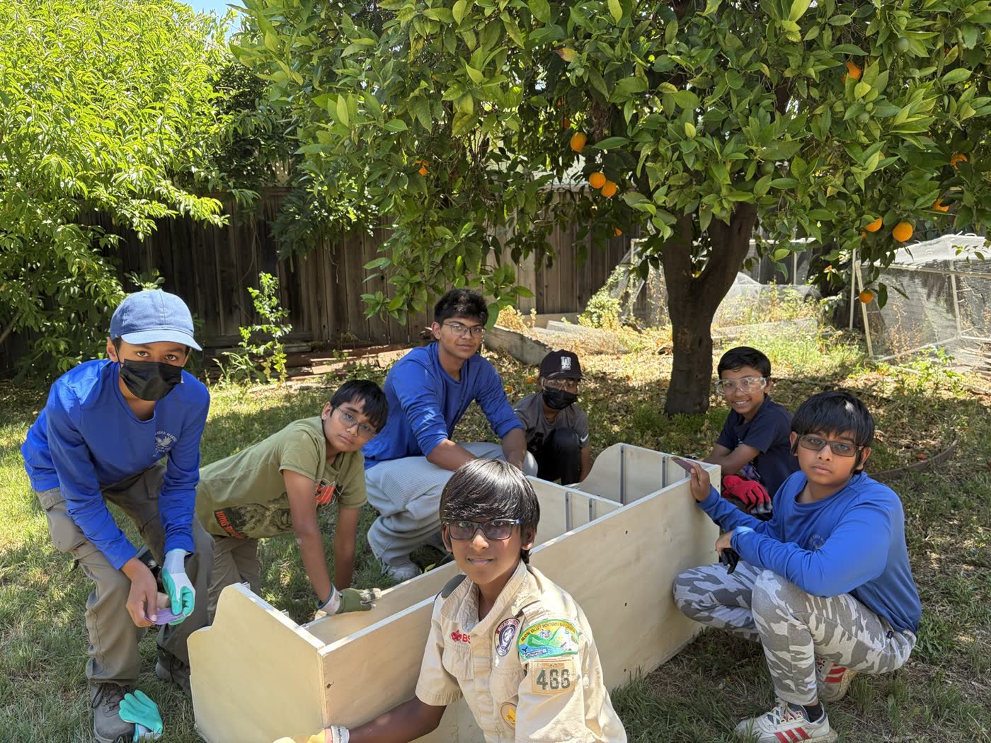 Scouts assembling the cart outdoors on build day