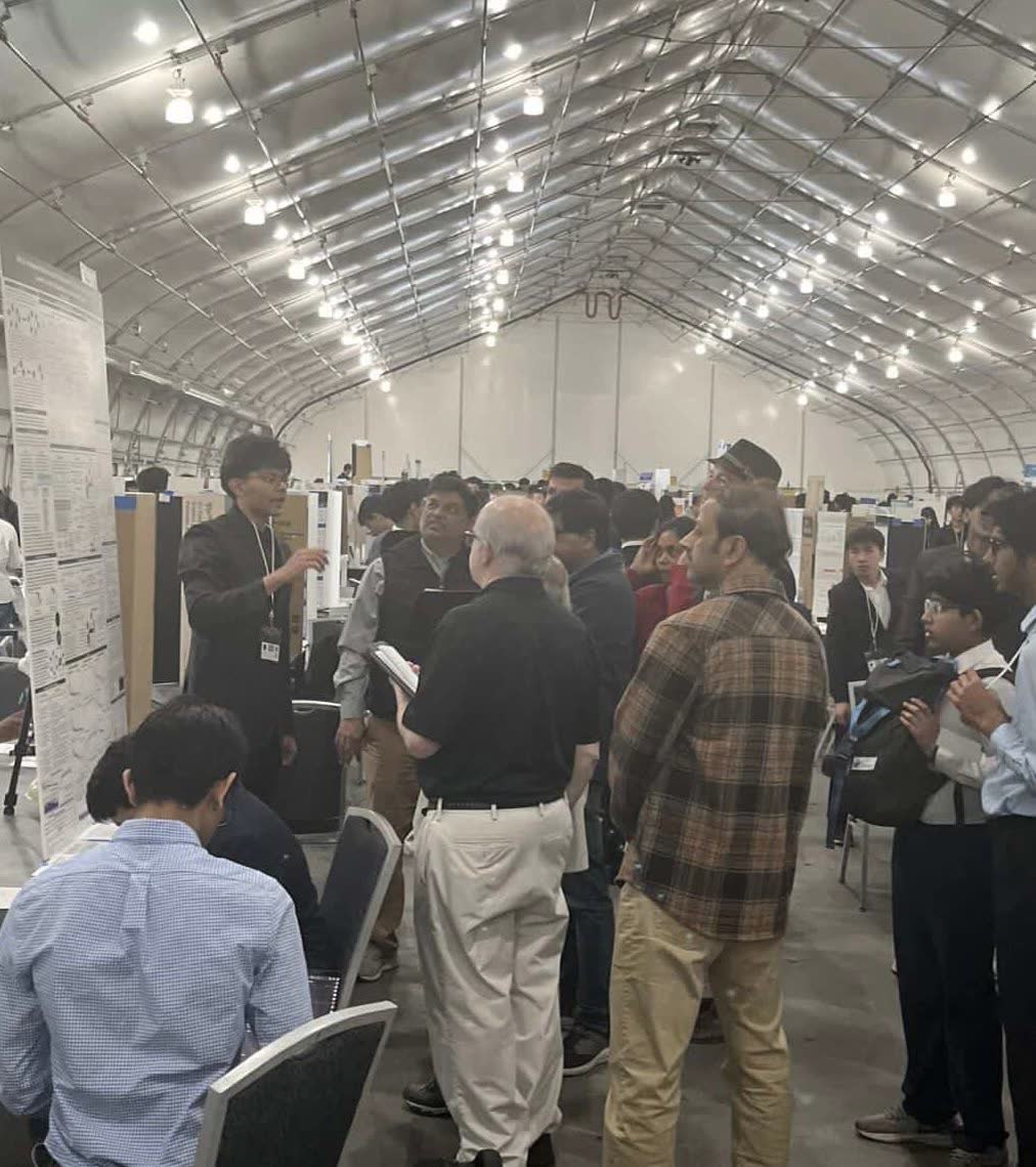 Vihaan presenting his research to a crowd at the science fair