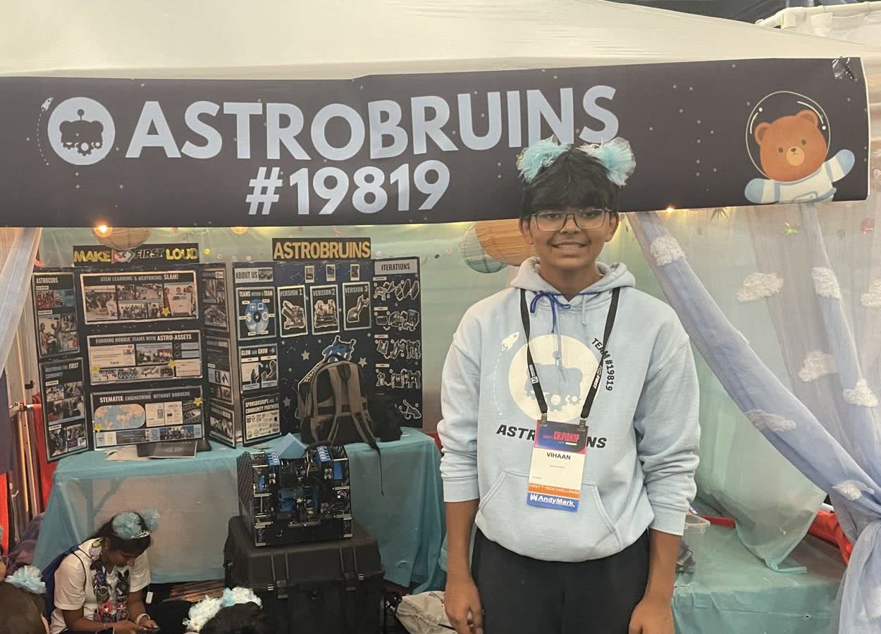 Vihaan at his robotics team's booth at the FTC World Championship