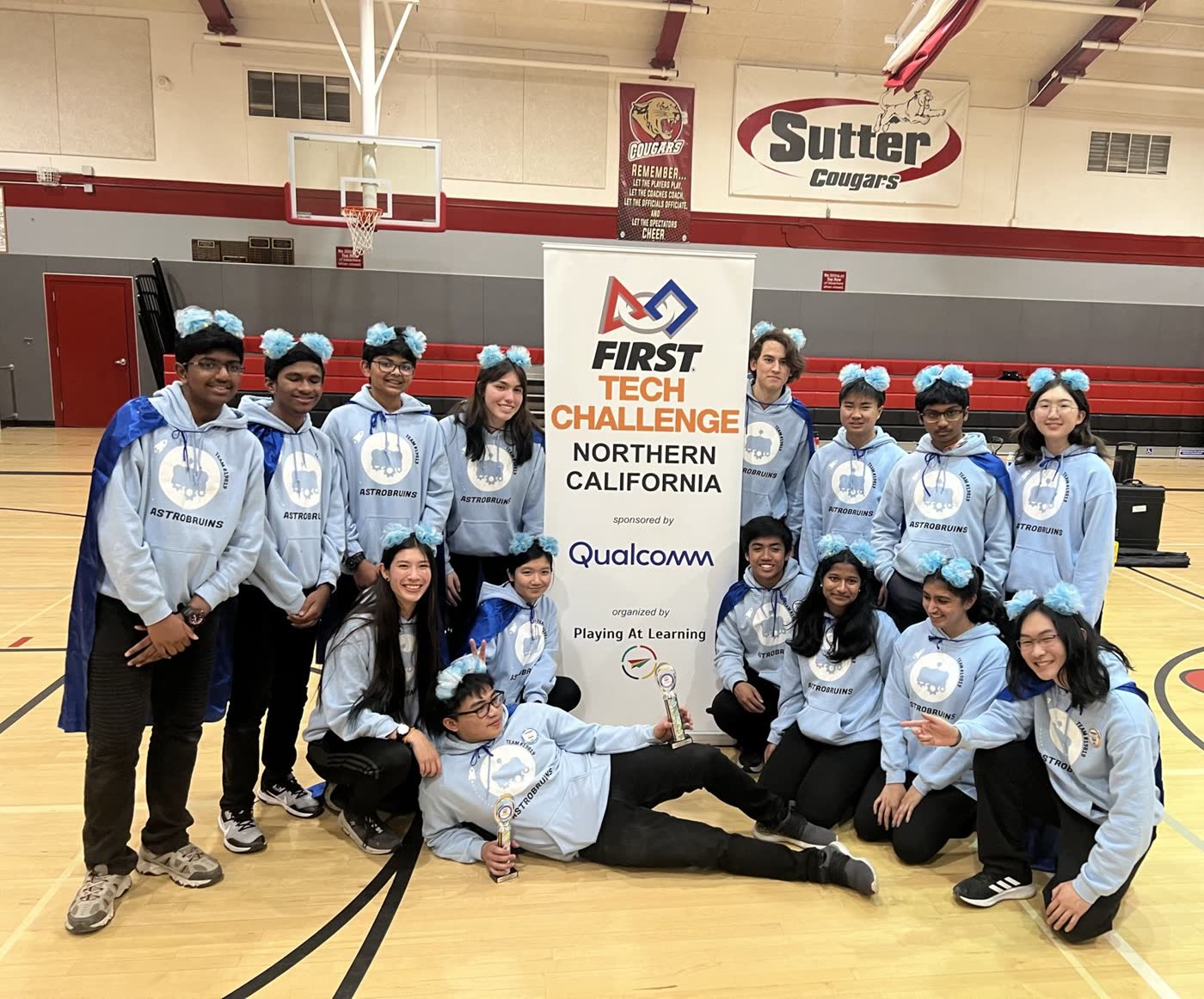 The FTC team with two trophies at a Northern California event