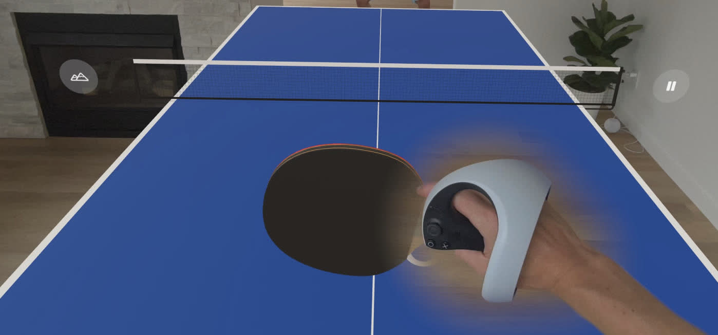 Playing in a living room with a hand controller as the paddle
